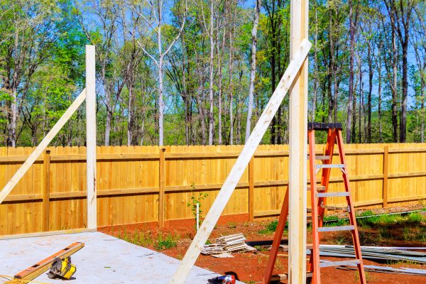 Work in progress view of construction unfinished house with wooden framing beams